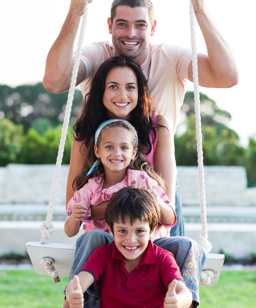 Family having fun on a swing